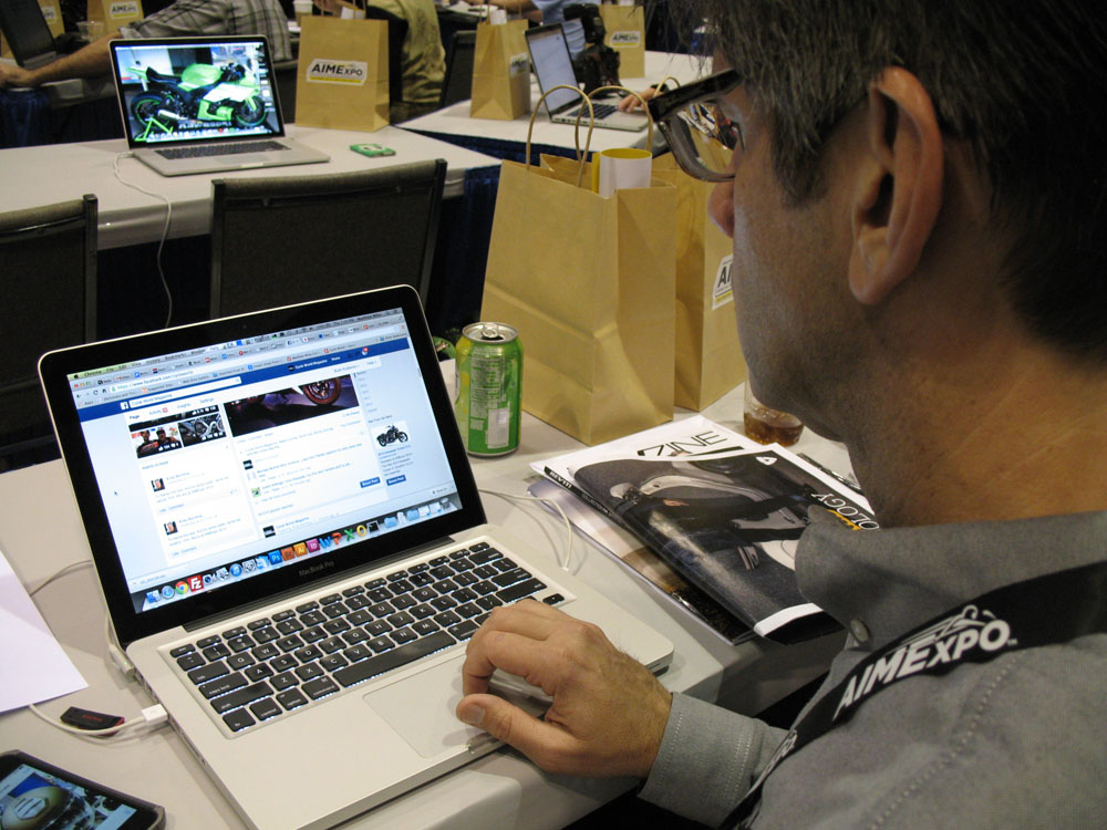 Cycle World Sr. Editor Matthew Miles working in the media center